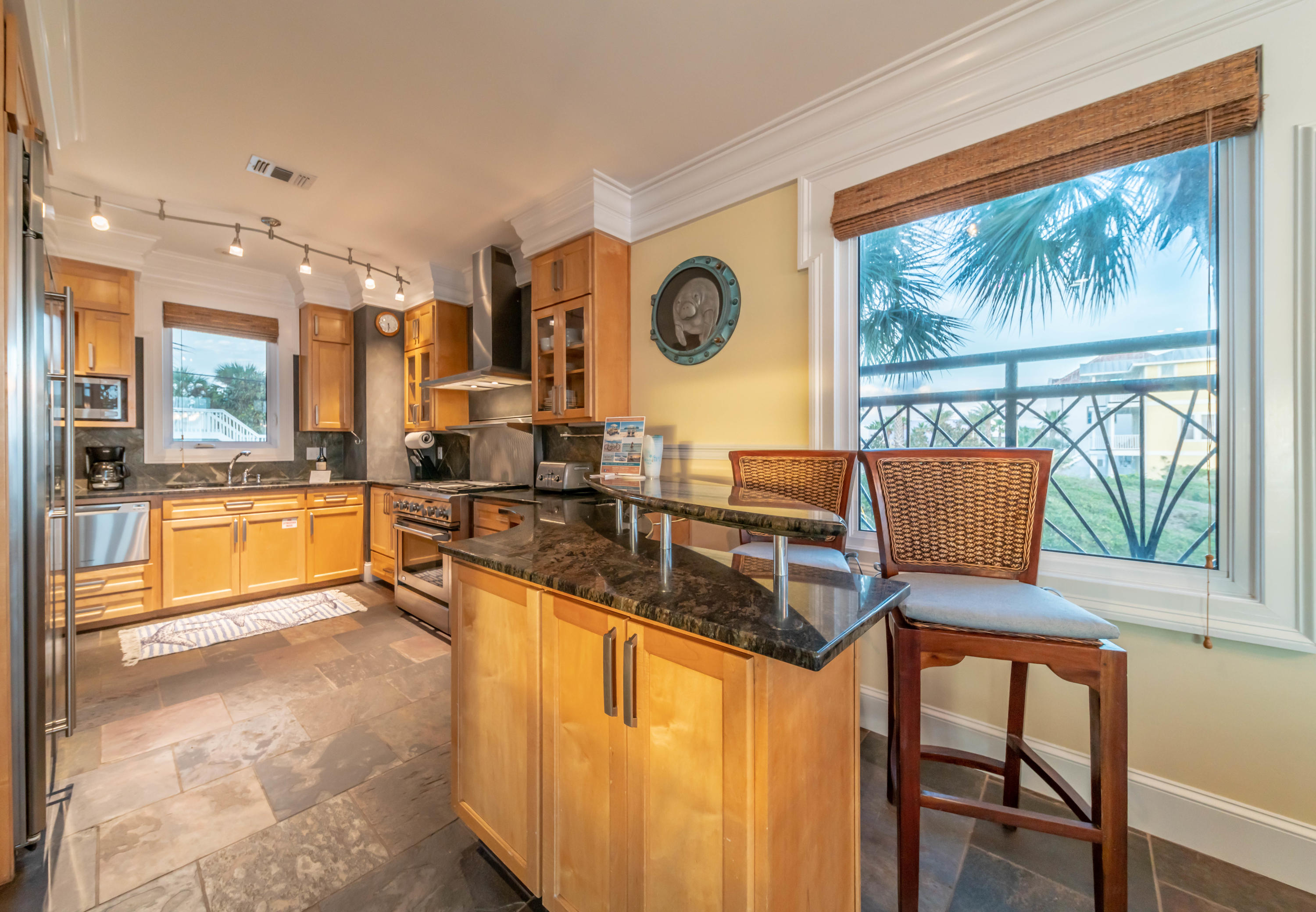 260 South Wall Street Inlet Beach, FL 32461 - Photo 50 of 59 a kitchen with a table chairs and a view of living room