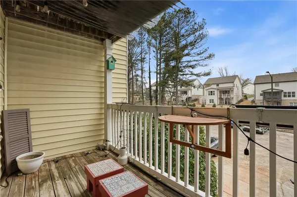 a view of a balcony with chairs