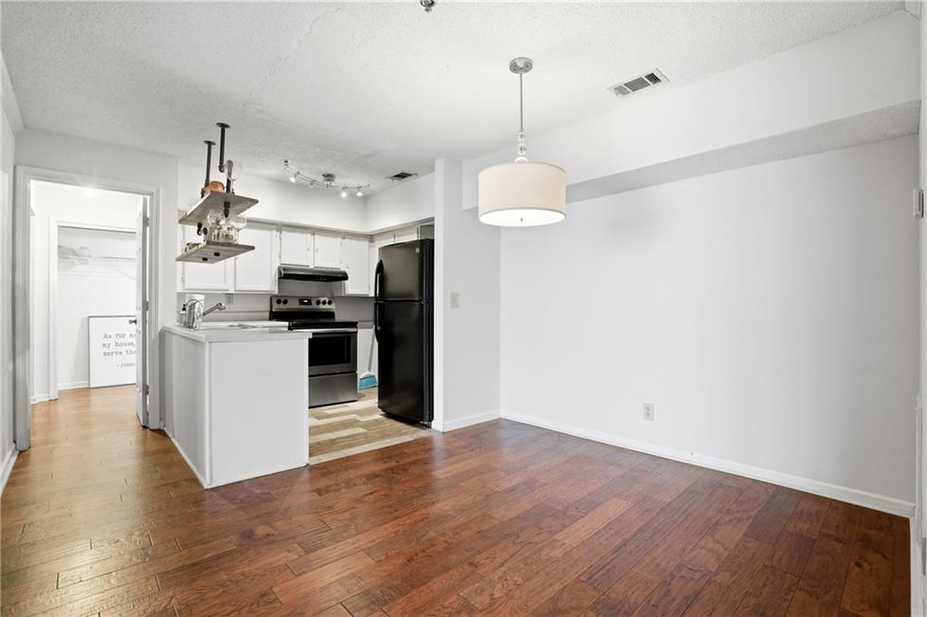 561 Cobblestone Trail Avondale Estates, GA 30002 - Photo 4 of 13 a view of kitchen with refrigerator microwave and stove