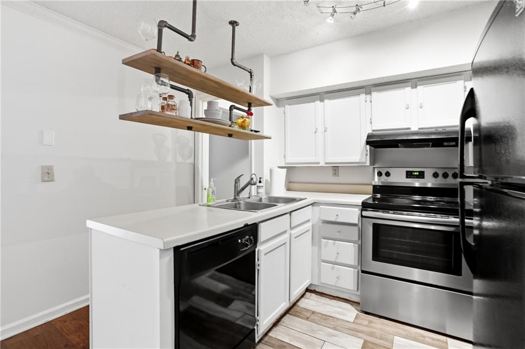 561 Cobblestone Trail Avondale Estates, GA 30002 - Photo 5 of 13 a kitchen with appliances cabinets and a sink