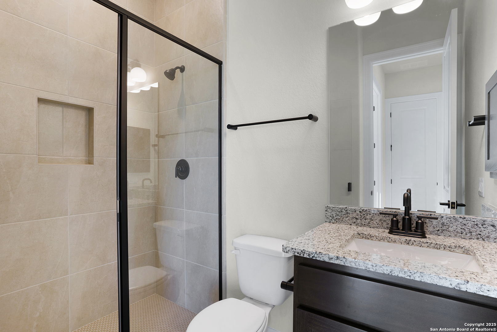 972 Nolte Bend Seguin, TX 78155 - Photo 13 of 65 a bathroom with a granite countertop sink toilet and shower