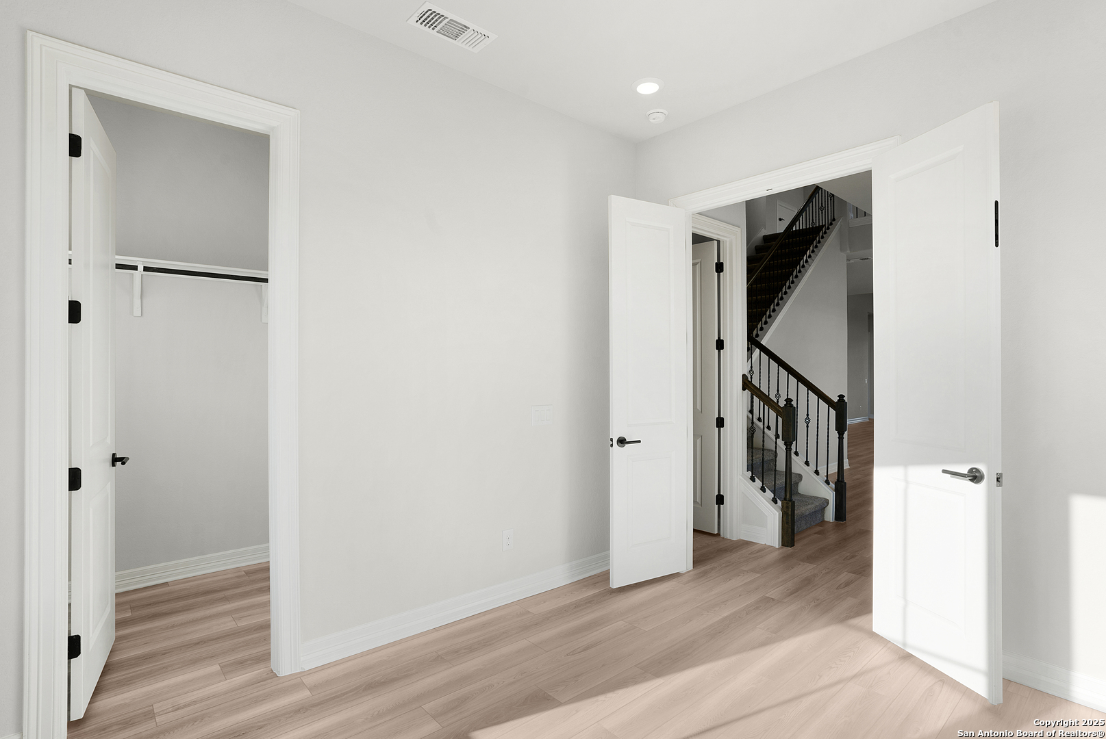 972 Nolte Bend Seguin, TX 78155 - Photo 15 of 65 a view of a hallway with wooden floor and entryway