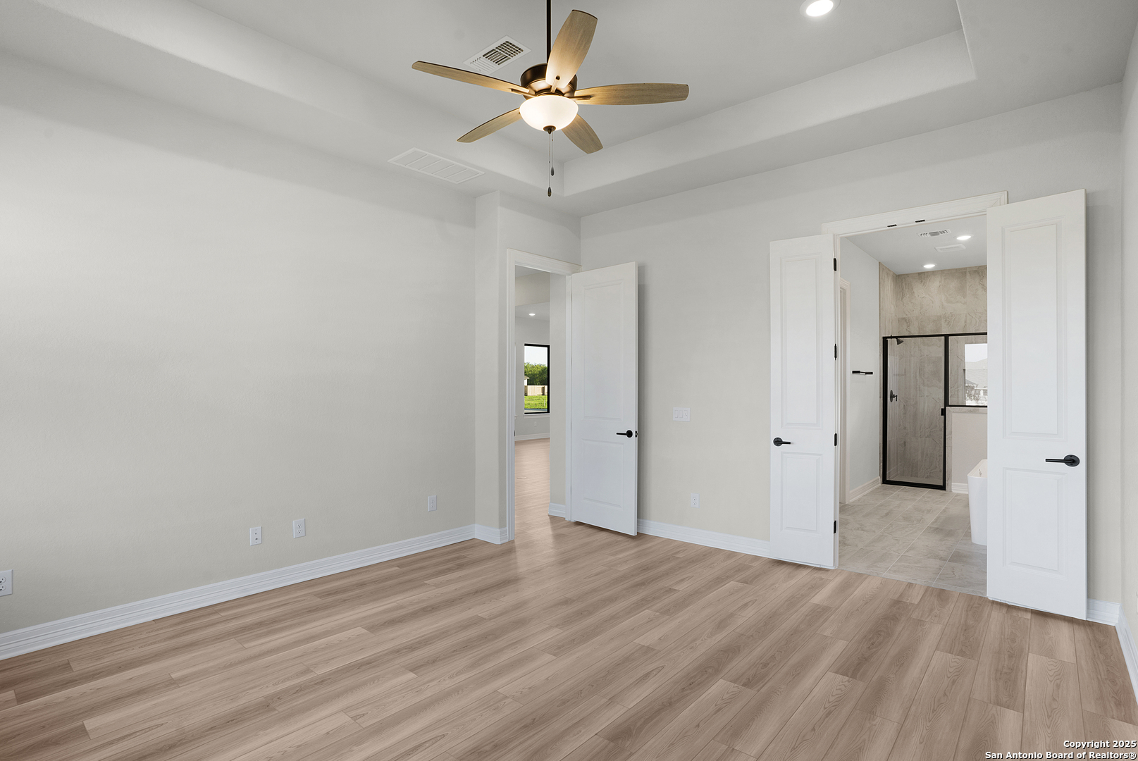 972 Nolte Bend Seguin, TX 78155 - Photo 37 of 65 an empty room with wooden floor and a ceiling fan