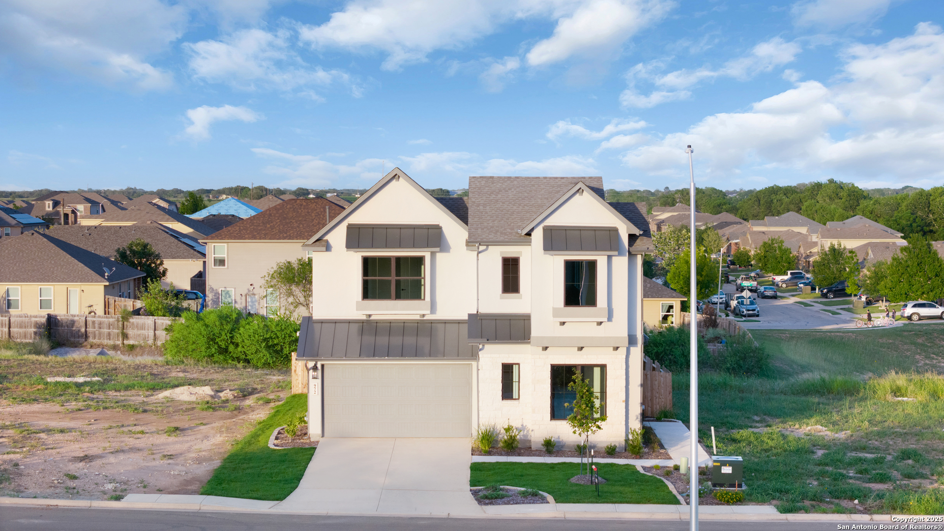 972 Nolte Bend Seguin, TX 78155 - Photo 5 of 65 a view of a white house next to a yard with big trees