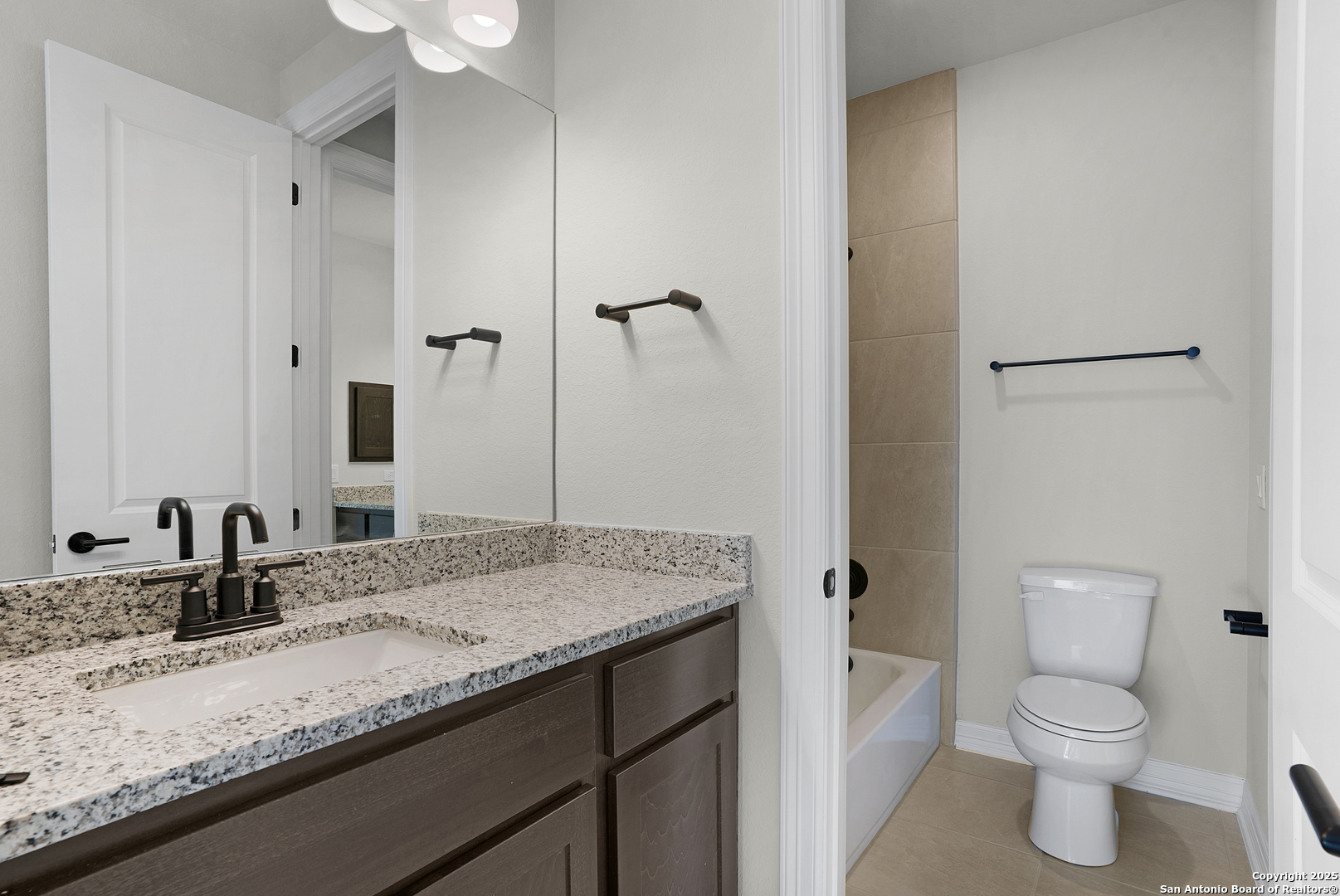 972 Nolte Bend Seguin, TX 78155 - Photo 51 of 65 a bathroom with a granite countertop sink toilet and shower