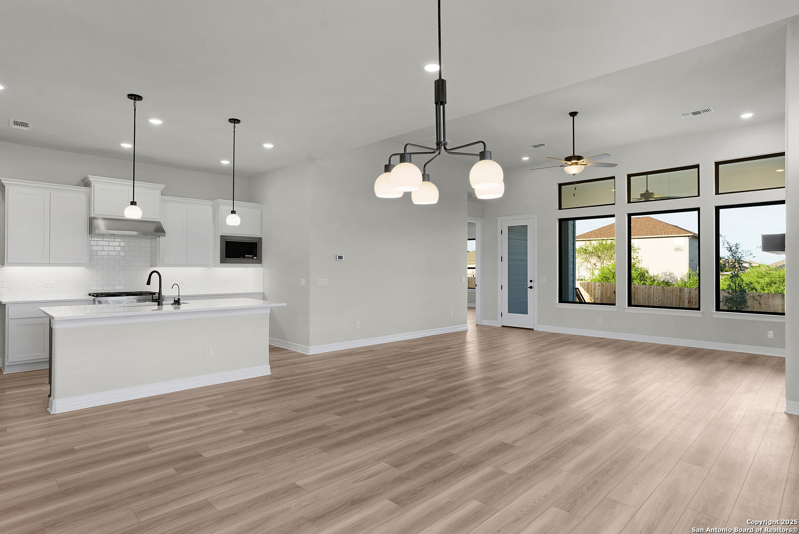 972 Nolte Bend Seguin, TX 78155 - Photo 57 of 65 a view of a kitchen with a sink wooden floor and a chandelier