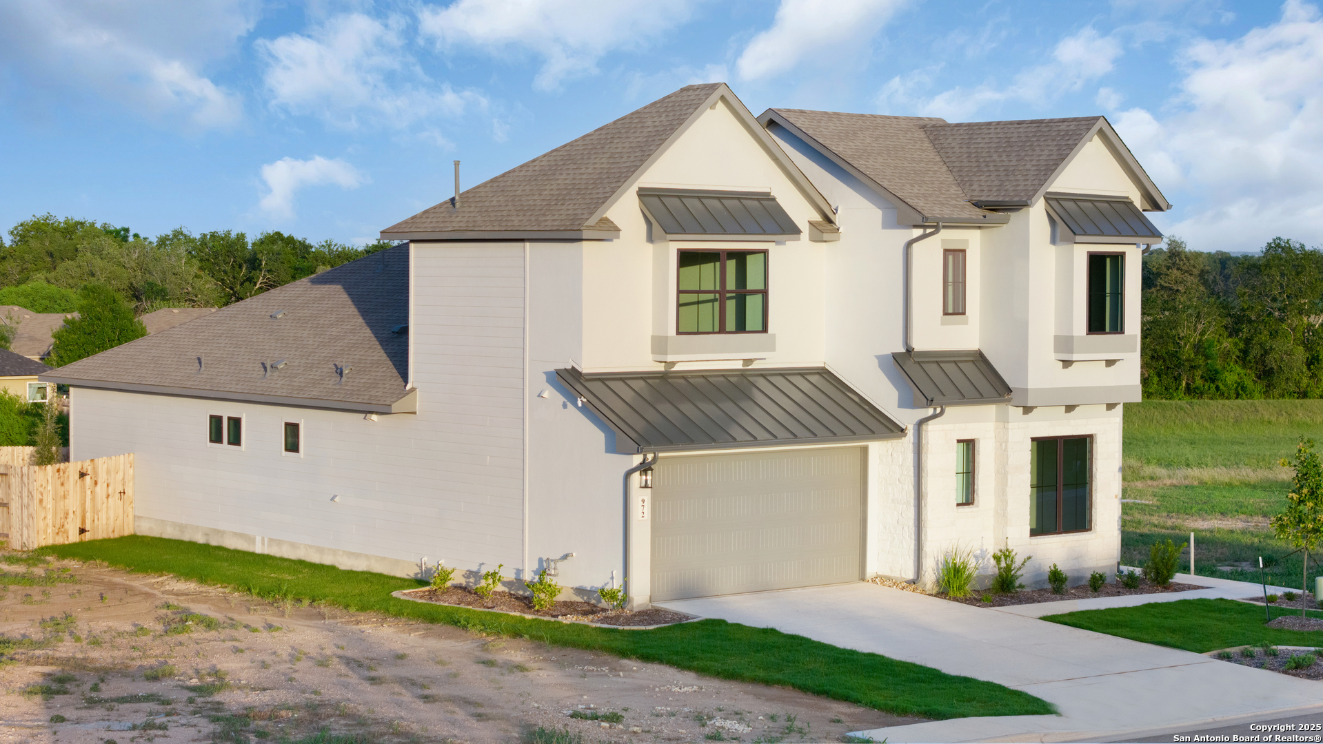 972 Nolte Bend Seguin, TX 78155 - Photo 8 of 65 a front view of a house with a yard and garage