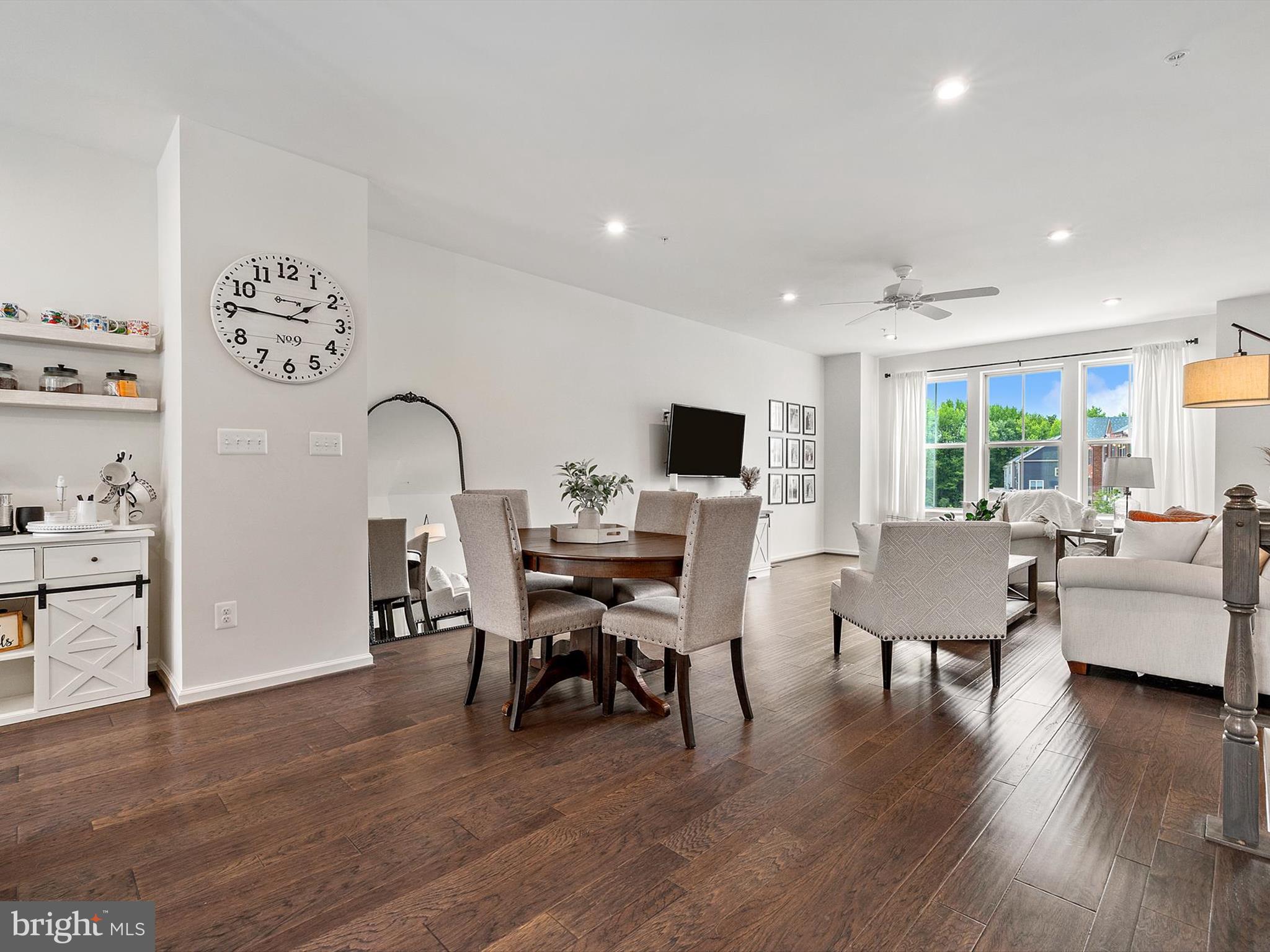 3058 Bretons Ridge Way Hanover, MD 21076 - Photo 12 of 43 a view of a dining room with furniture window and wooden floor