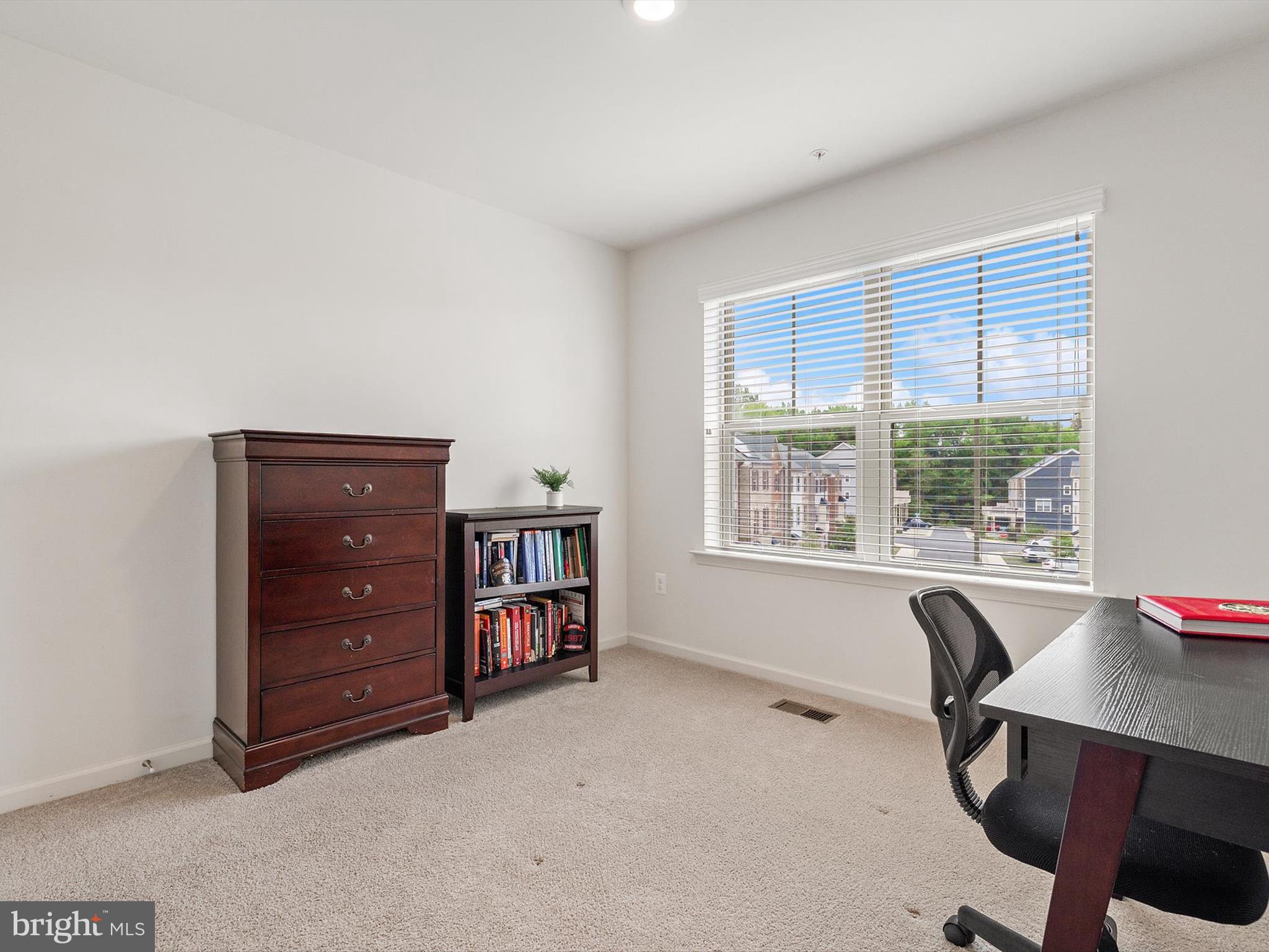 3058 Bretons Ridge Way Hanover, MD 21076 - Photo 19 of 43 a view of a workspace with furniture and a window