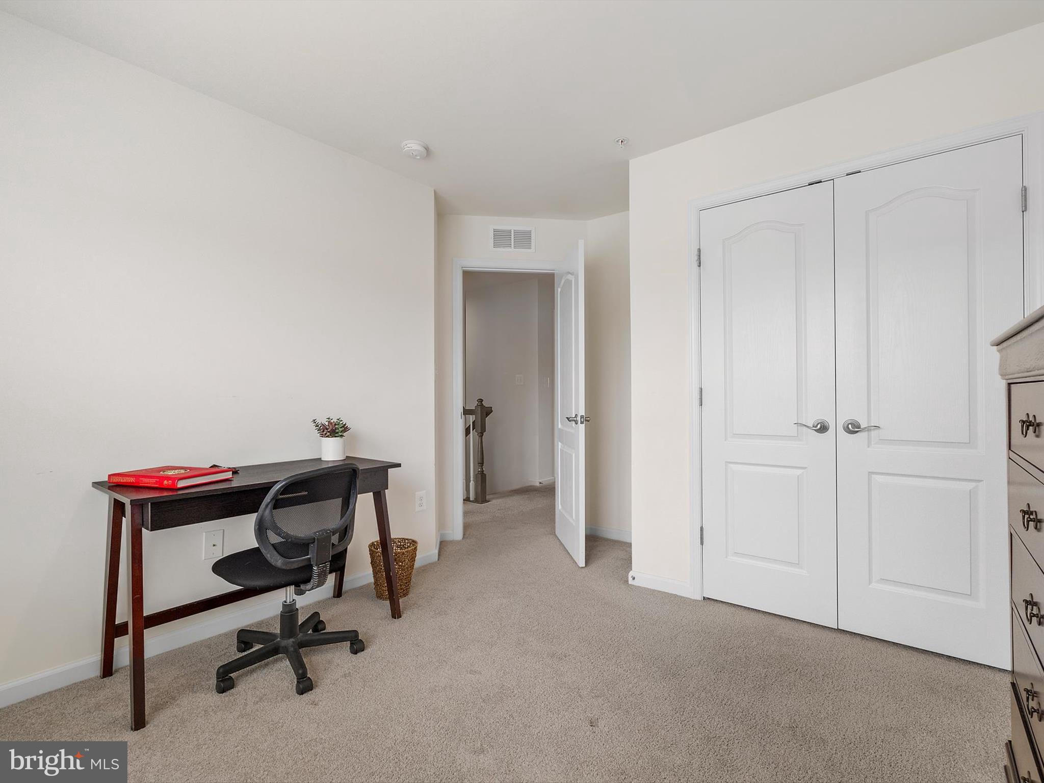 3058 Bretons Ridge Way Hanover, MD 21076 - Photo 20 of 43 a view of a workspace with furniture and a bathroom