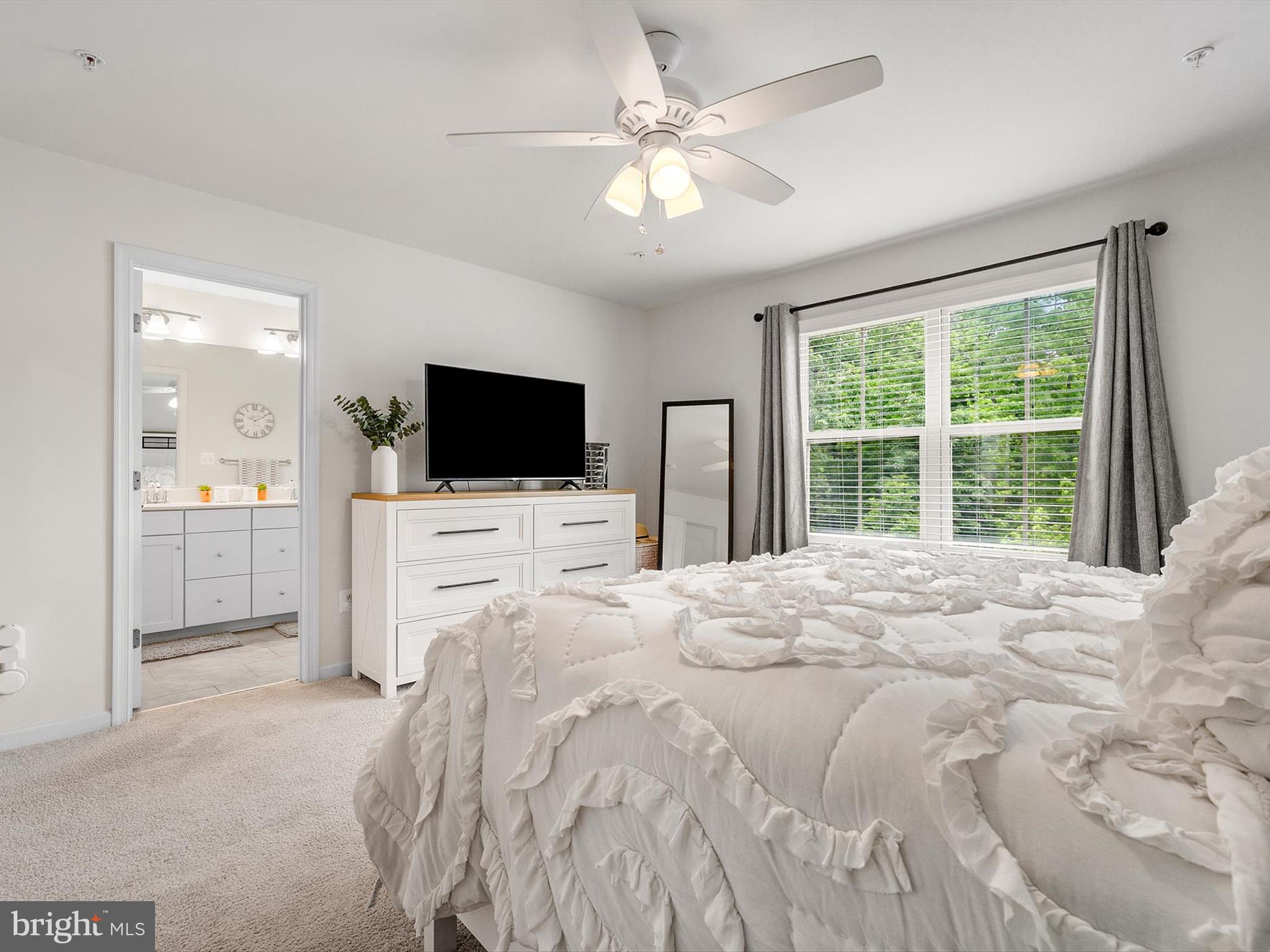 3058 Bretons Ridge Way Hanover, MD 21076 - Photo 27 of 43 a bedroom with a bed tv and a window