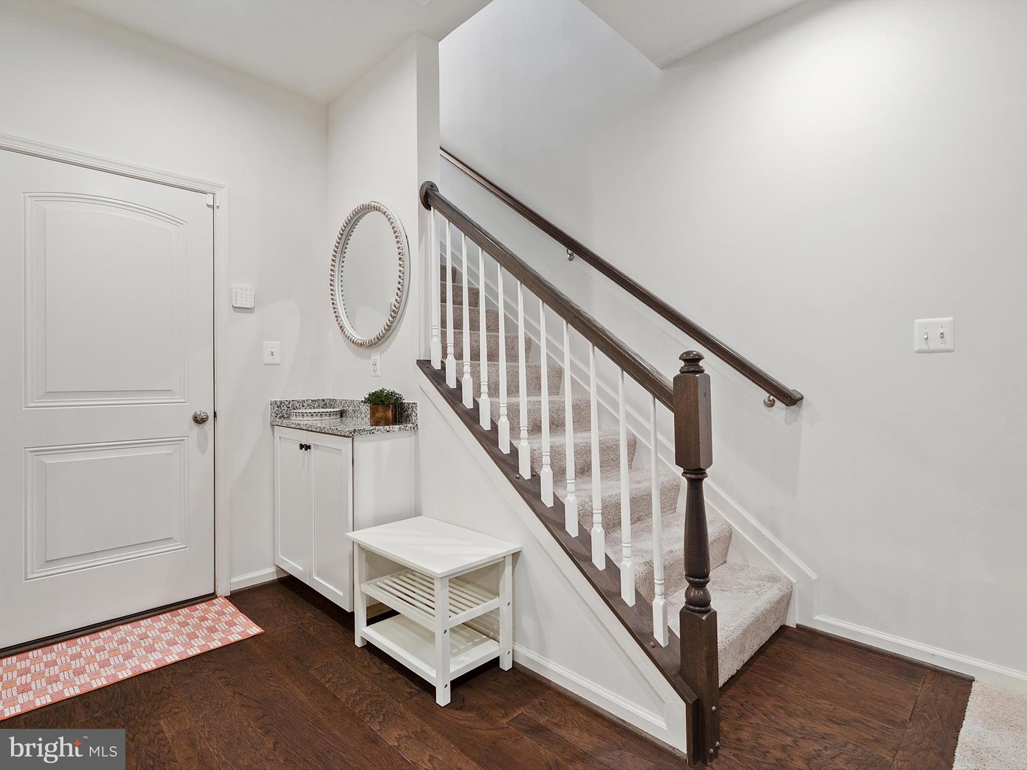 3058 Bretons Ridge Way Hanover, MD 21076 - Photo 30 of 43 a view of an entryway with wooden floor