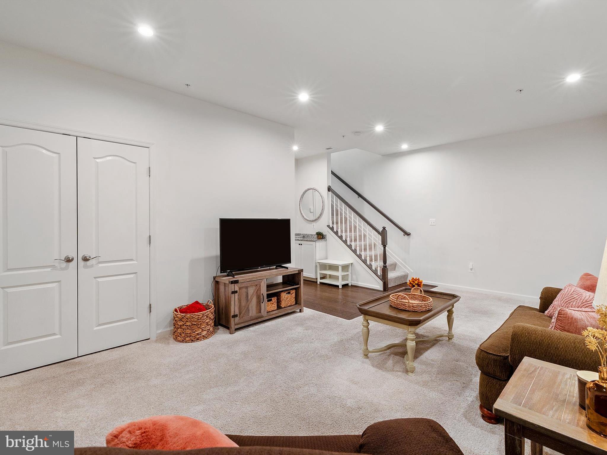 3058 Bretons Ridge Way Hanover, MD 21076 - Photo 31 of 43 a living room with furniture and a flat screen tv
