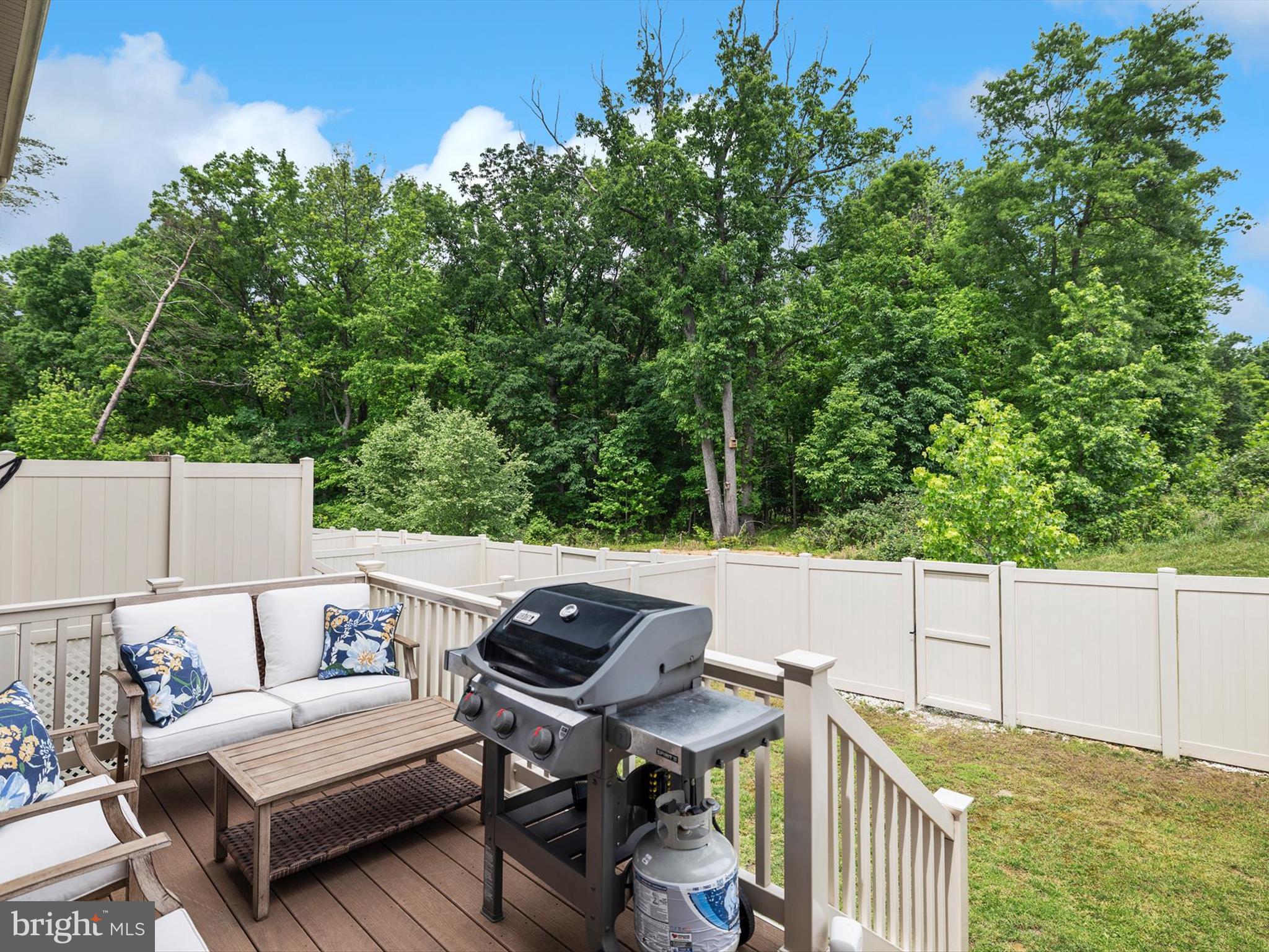 3058 Bretons Ridge Way Hanover, MD 21076 - Photo 34 of 43 a view of a patio with a table and chairs