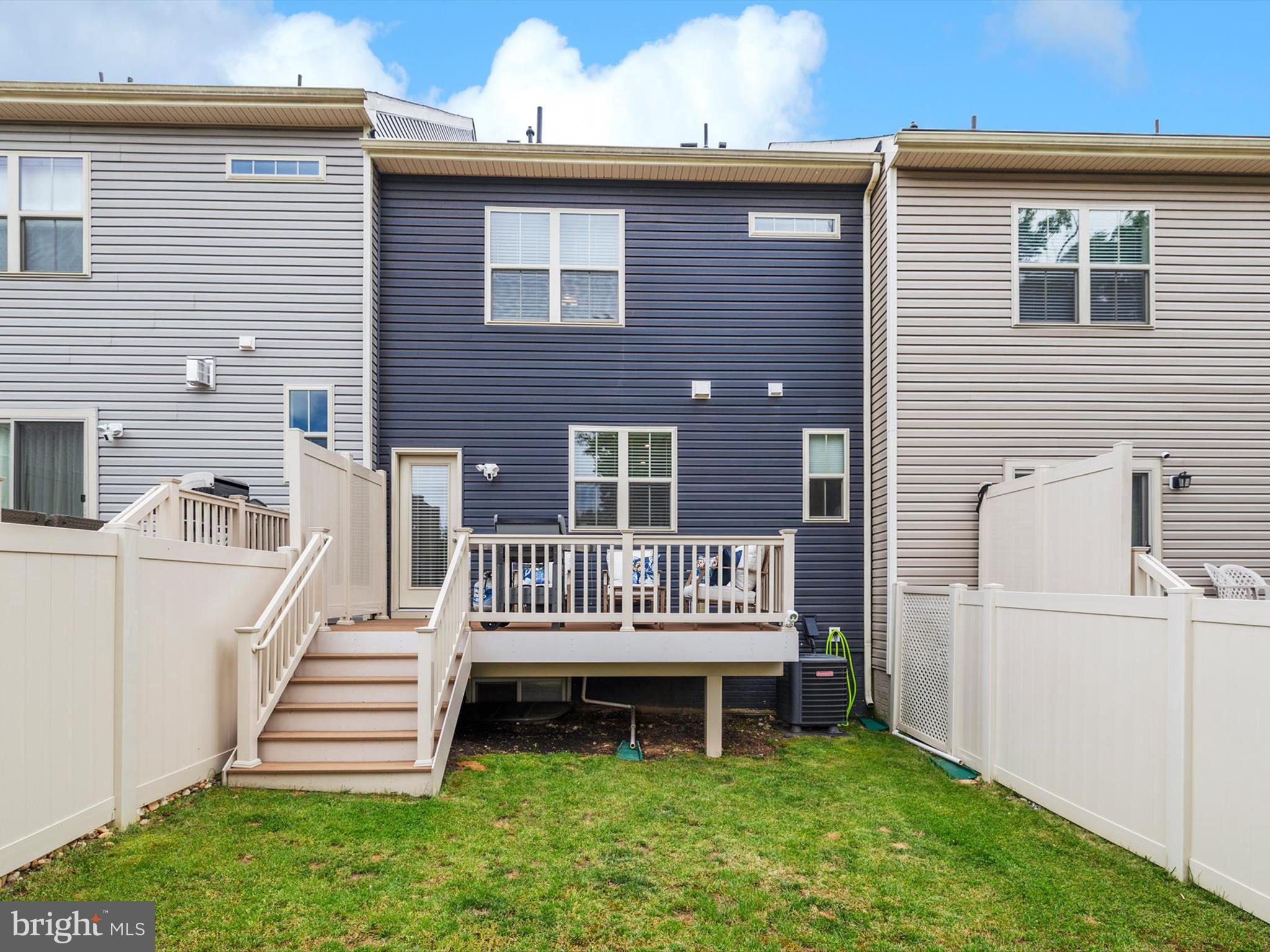 3058 Bretons Ridge Way Hanover, MD 21076 - Photo 39 of 43 a view of a house with a yard and deck
