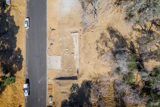 an aerial view of residential house with parking space