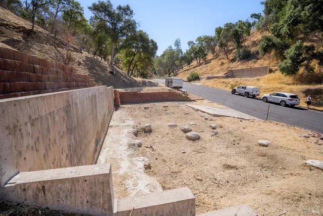 a view of a backyard of the house