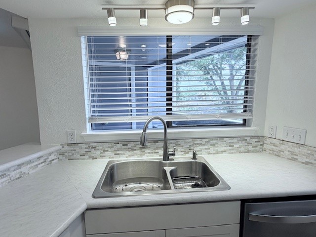 2500 Burleson Road, Unit 713 Austin, TX 78741 - Photo 5 of 15 A well-appointed kitchen offers ample counter space and a convenient double-basin sink.