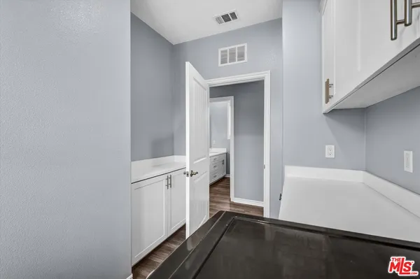 a view of an entryway with wooden floor