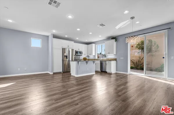 a view of kitchen with wooden floor