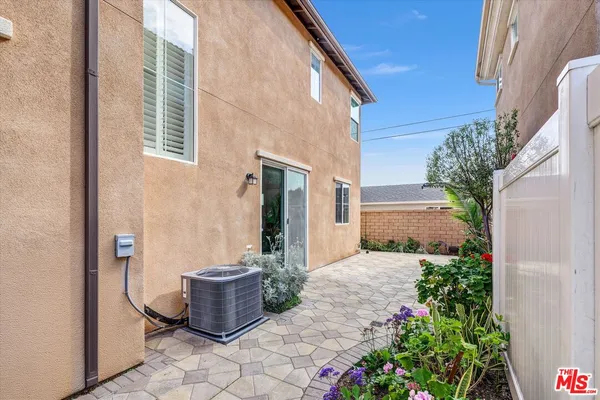 a view of a path along with potted plants