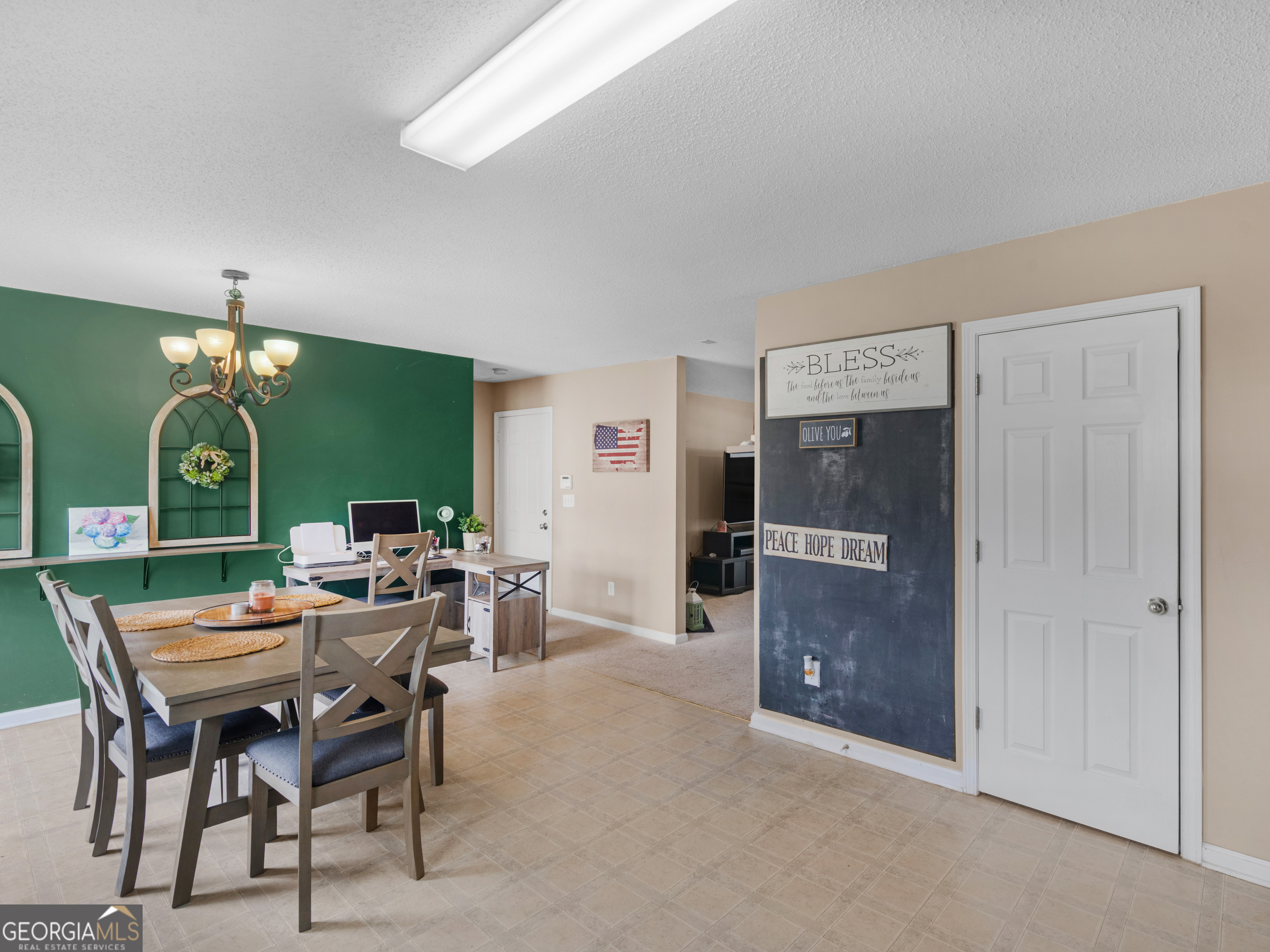 3370 Waggoner Place Rex, GA 30273 - Photo 10 of 25 a view of a livingroom with furniture and a flat screen tv