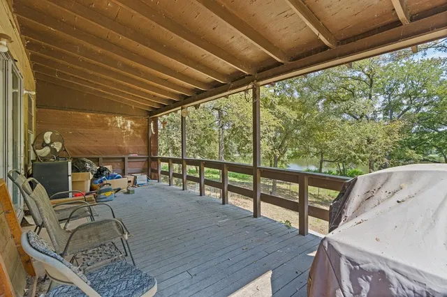 a view of a balcony with chairs