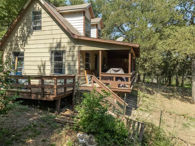 aerial view of a house with a yard
