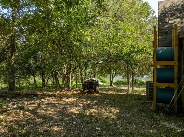 a view of outdoor space with deck and tree