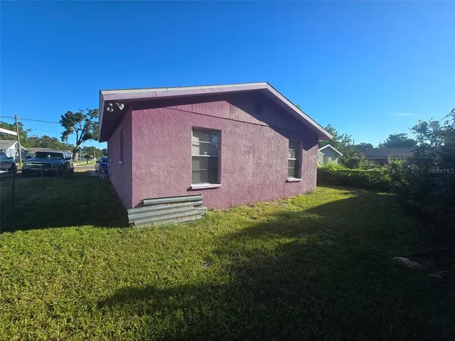 a backyard of a house with lots of green space