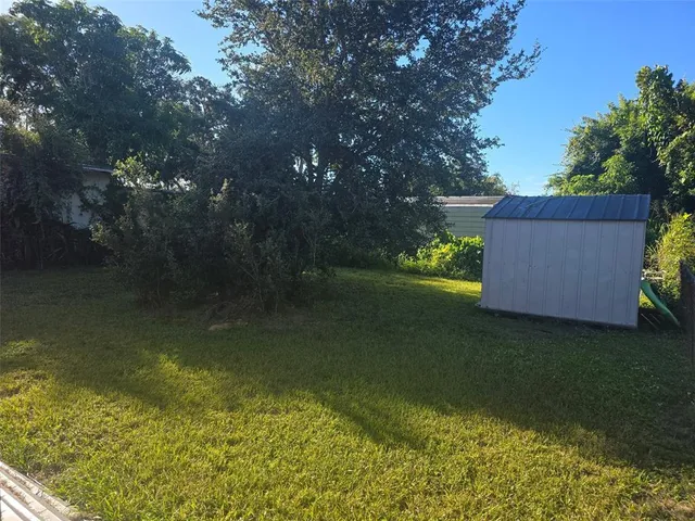 a backyard of a house with lots of green space