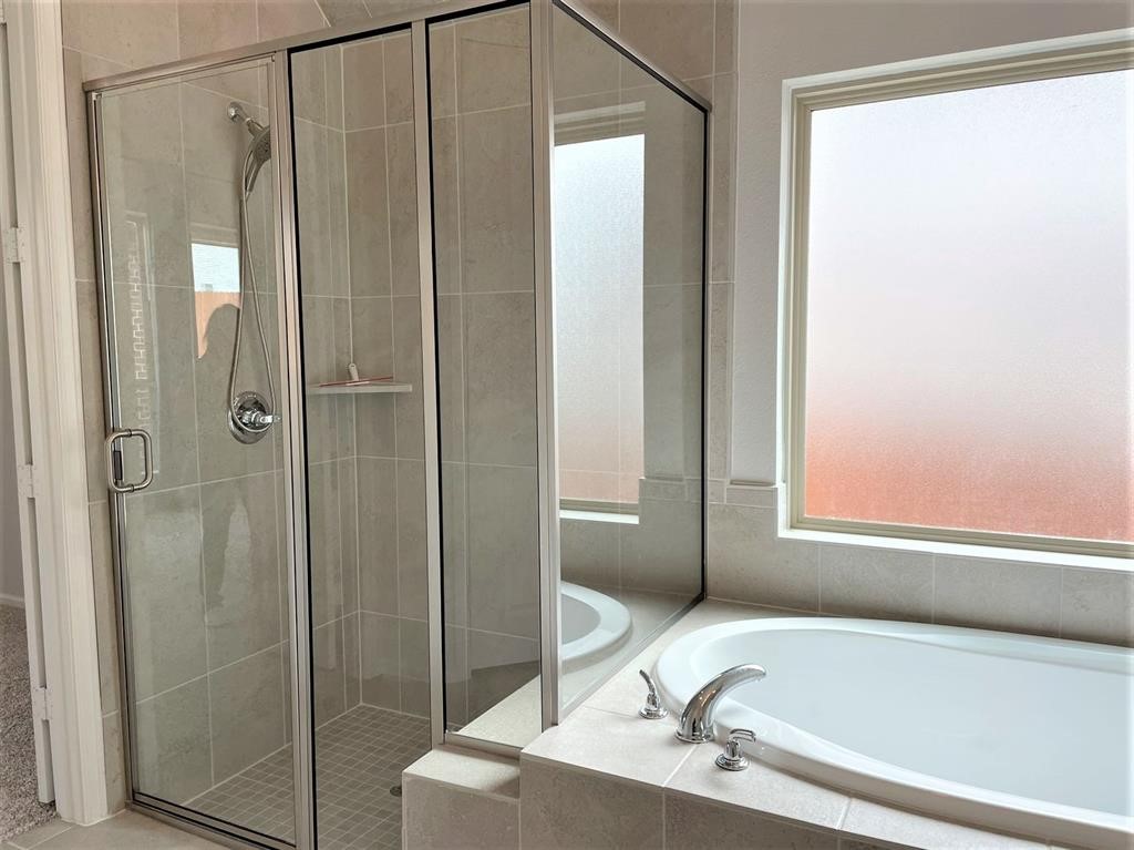 156 Santa Maria Street Georgetown, TX 78628 - Photo 28 of 39 a bathroom with a granite countertop sink and shower