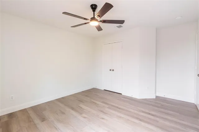a view of a big room with wooden floor