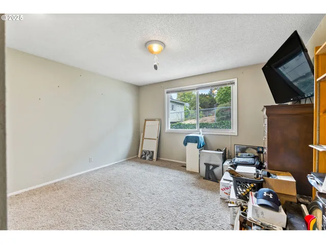 a room with furniture and a flat screen tv