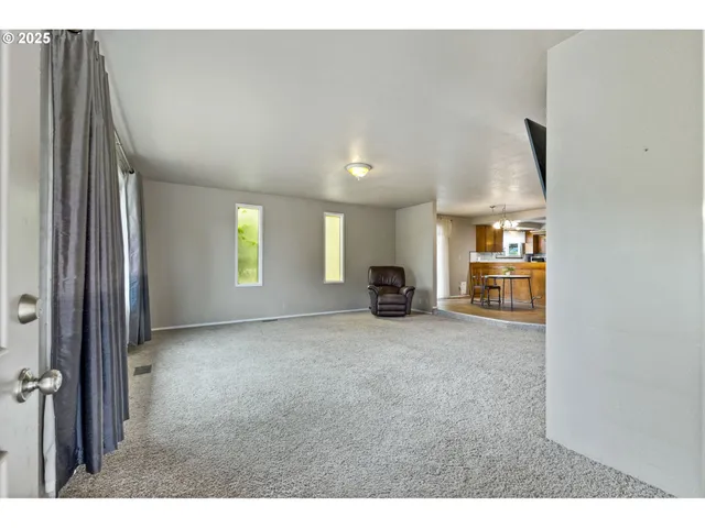 a view of livingroom with furniture and flat screen tv