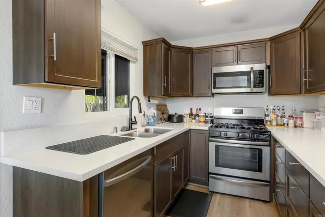 a kitchen with a stove and a sink
