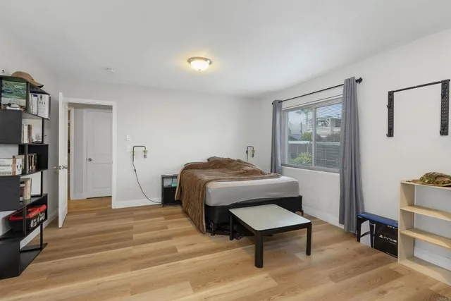 a bedroom with furniture and a window