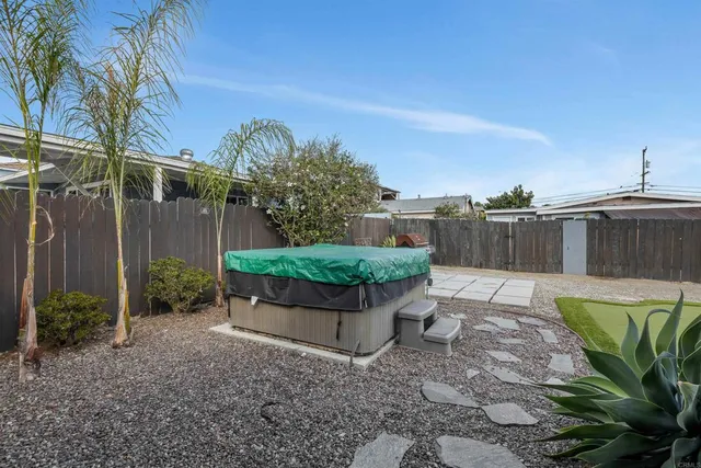 a view of a backyard with sitting area