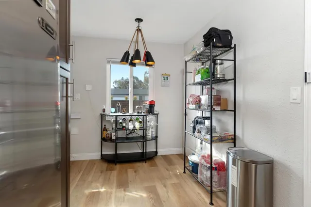 a view of living room with furniture and entryway