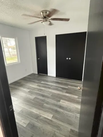 a view of room with a ceiling fan