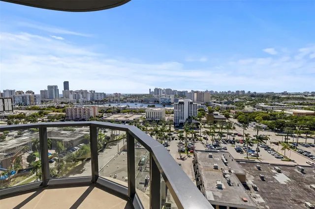 a spacious bedroom with a bed and a view of bathroom