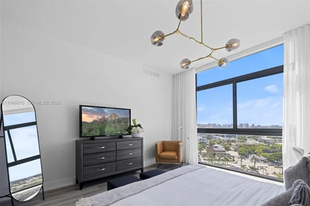 a bathroom with a granite countertop sink a toilet and a mirror