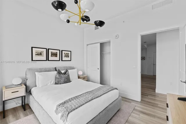 a living room with furniture and large windows