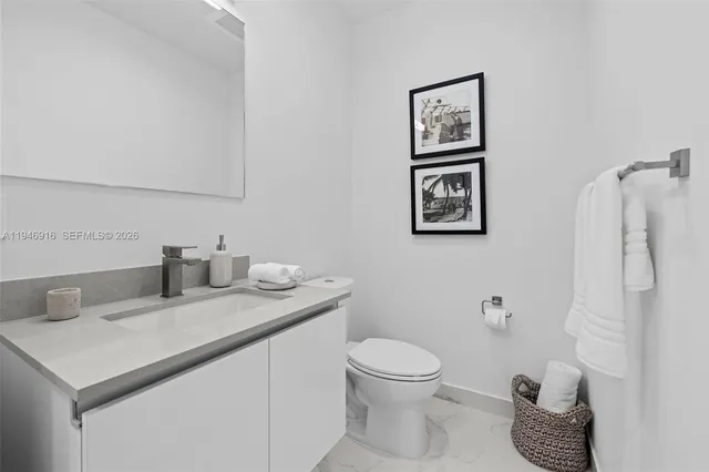 a kitchen with a table and chairs in it
