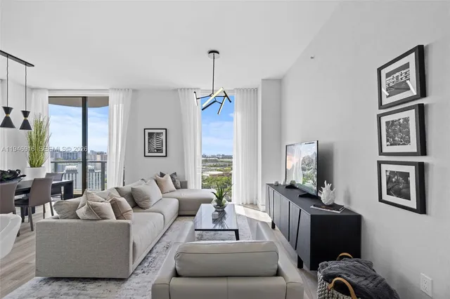 an aerial view of a residential houses with outdoor space