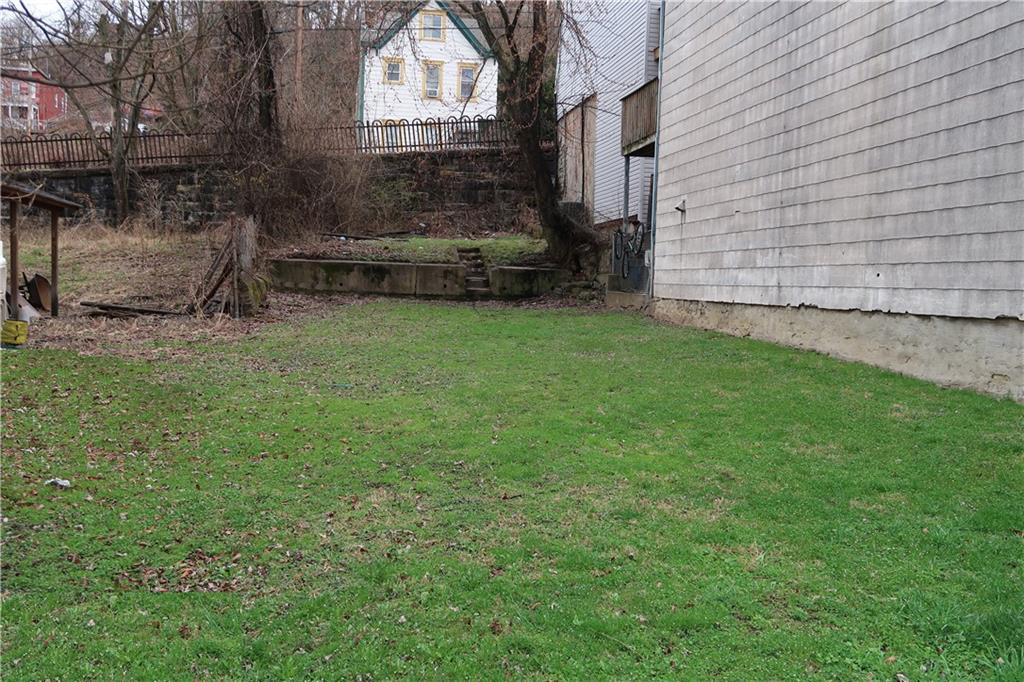 a backyard of a house with lots of green space