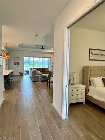 a view of living room filled with furniture and gym equipment