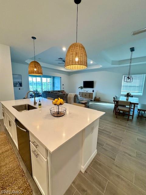 5856 Sunningdale St Avenue Immokalee, FL 34142 - Photo 14 of 44 a kitchen with stainless steel appliances a stove a sink a chimney a dining table and chairs