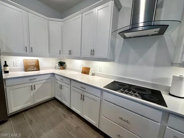 a kitchen with cabinets appliances and a sink