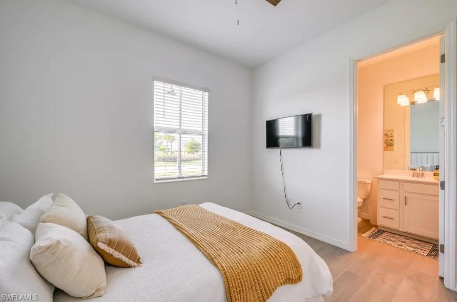 5856 Sunningdale St Avenue Immokalee, FL 34142 - Photo 20 of 44 a bedroom with a bed and a television